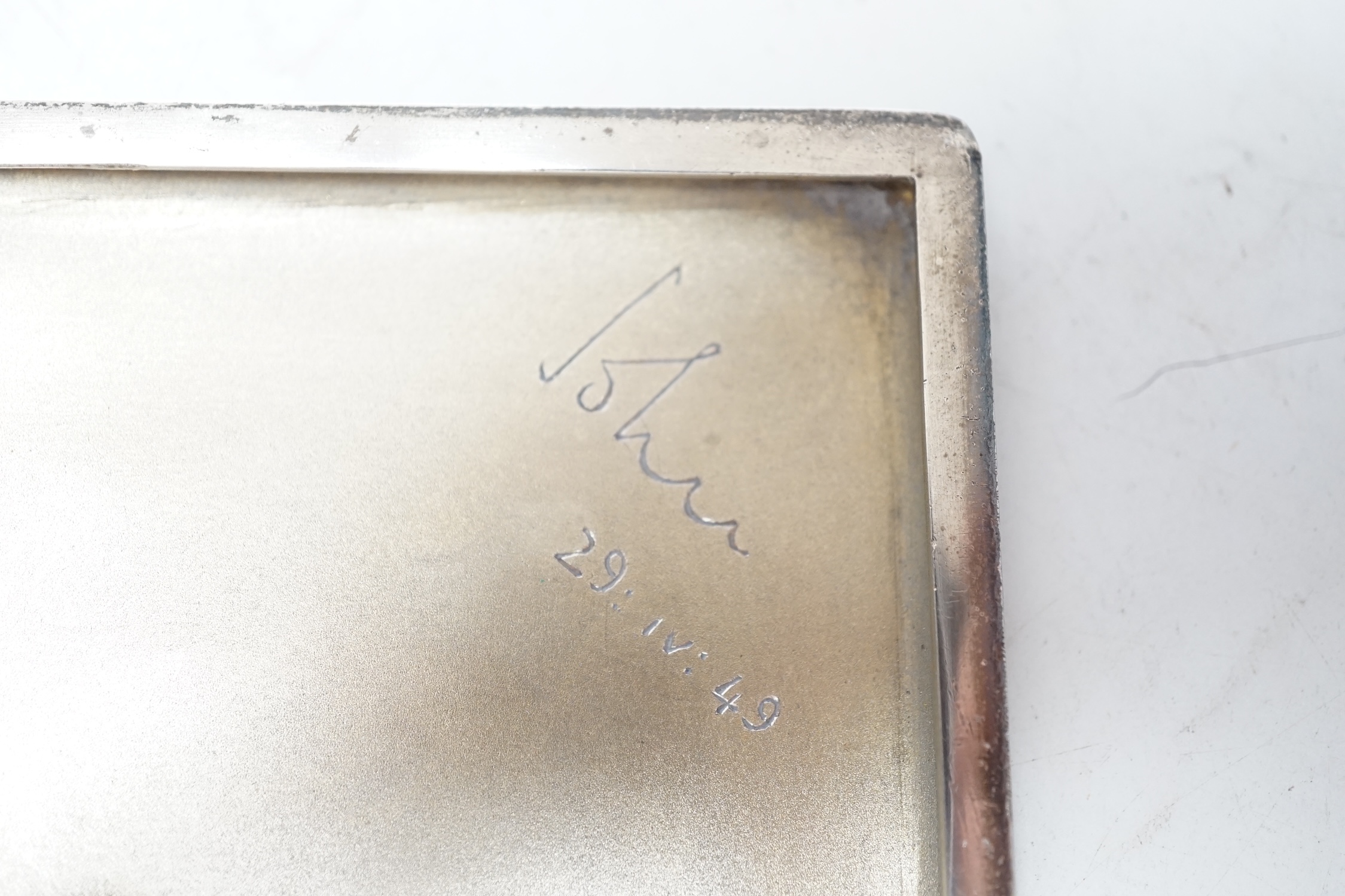 A George VI engine turned silver cigarette case, Birmingham, 1948, 11.6cm. Condition - fair